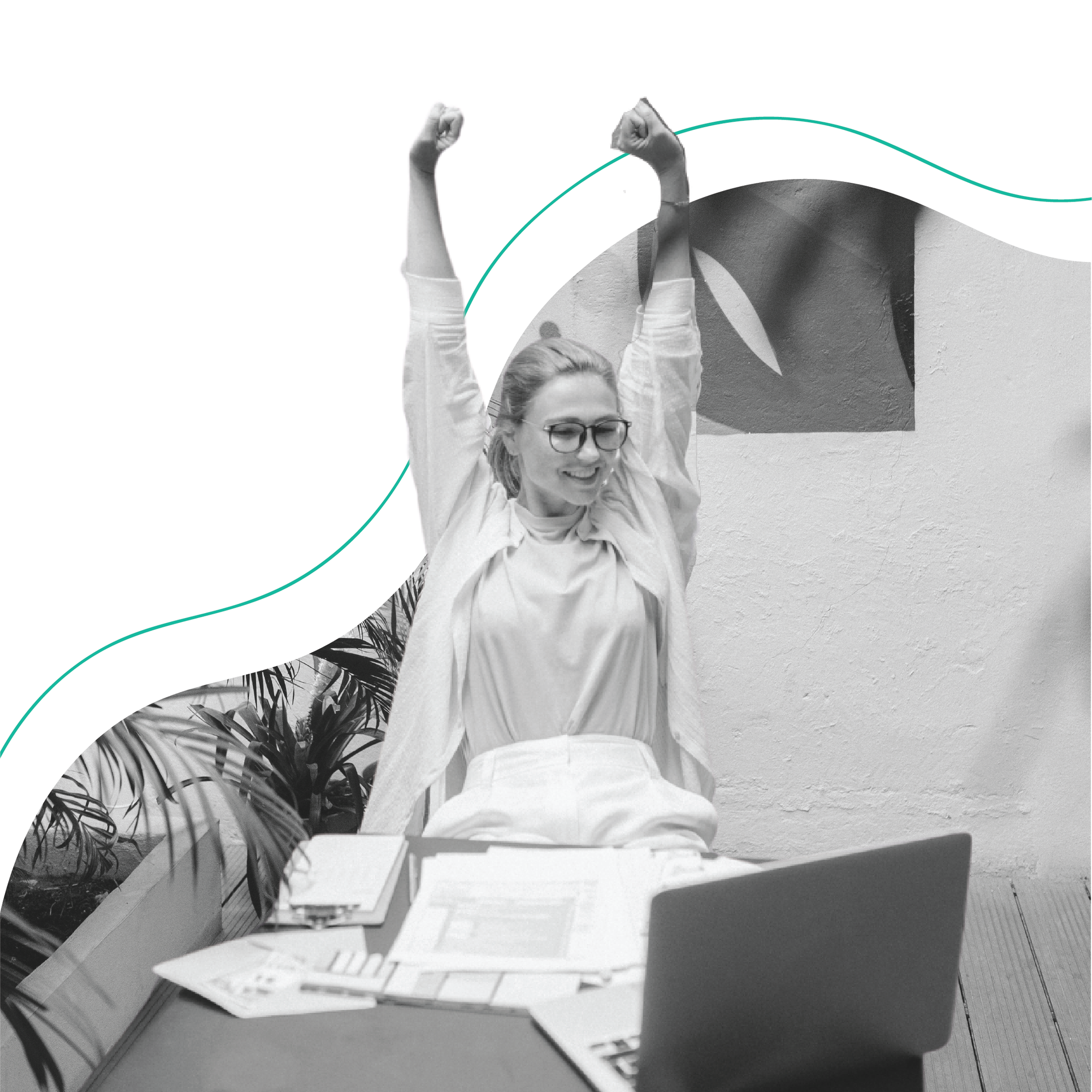 Woman sitting at desk with arms raised, celebrating