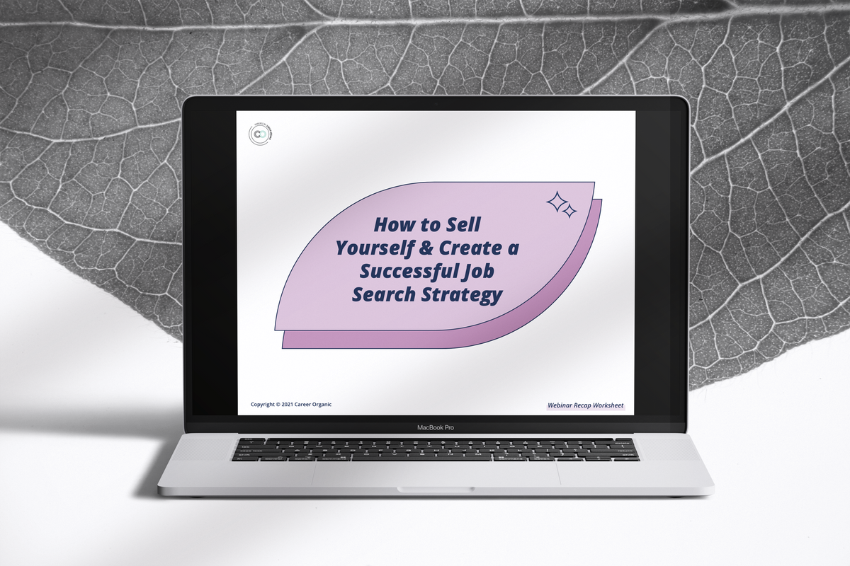 laptop with a large black and white leaf in the background, the screen displaying a free guide called how to sell yourself and create a successful job search strategy